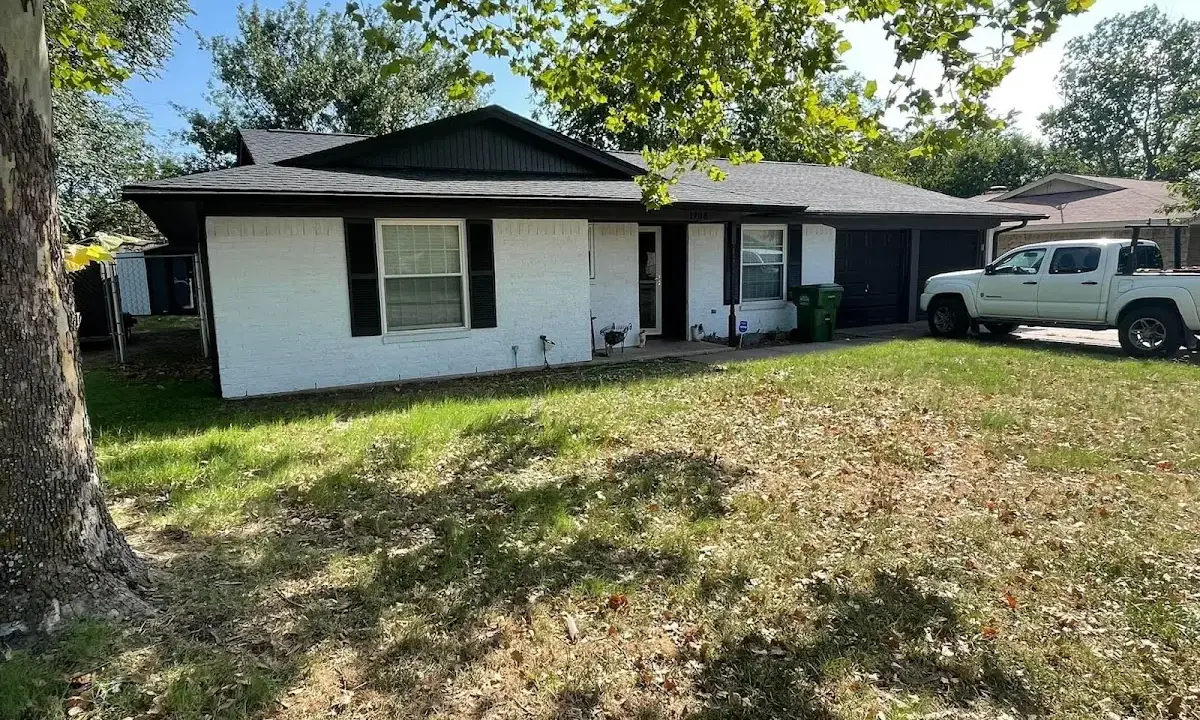 Professional roofing crew working on a residential roof in Pawtucket